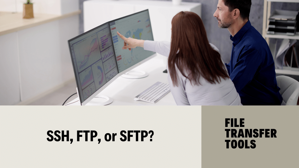 Two people look a computer screen and contemplate SSH vs. FTP vs. SFTP.